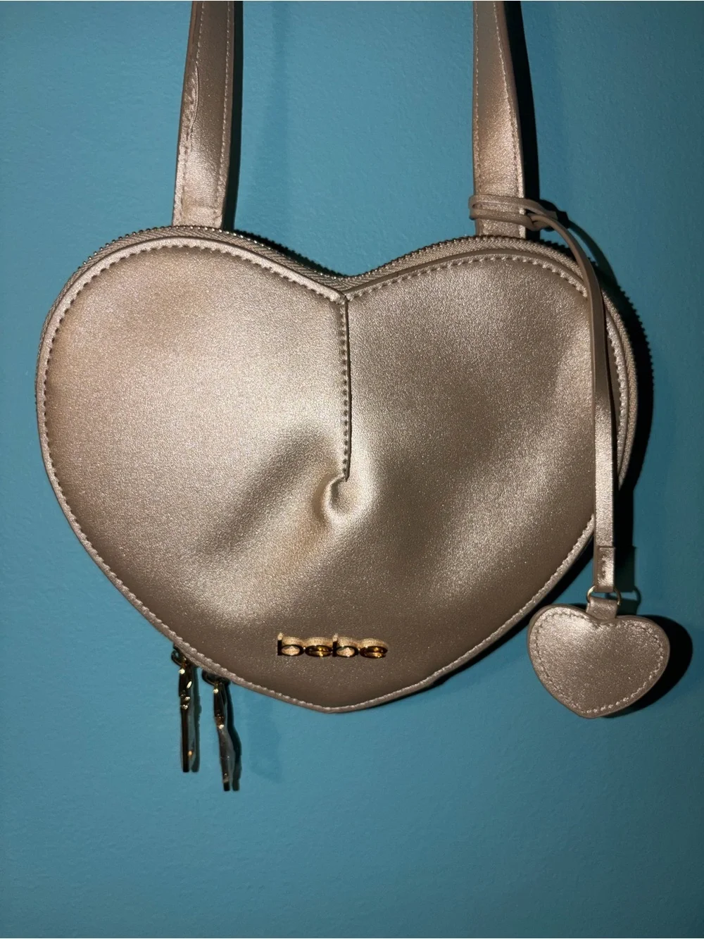 bebe Metallic Champagne Heart Crossbody Bag with Gold Logo
